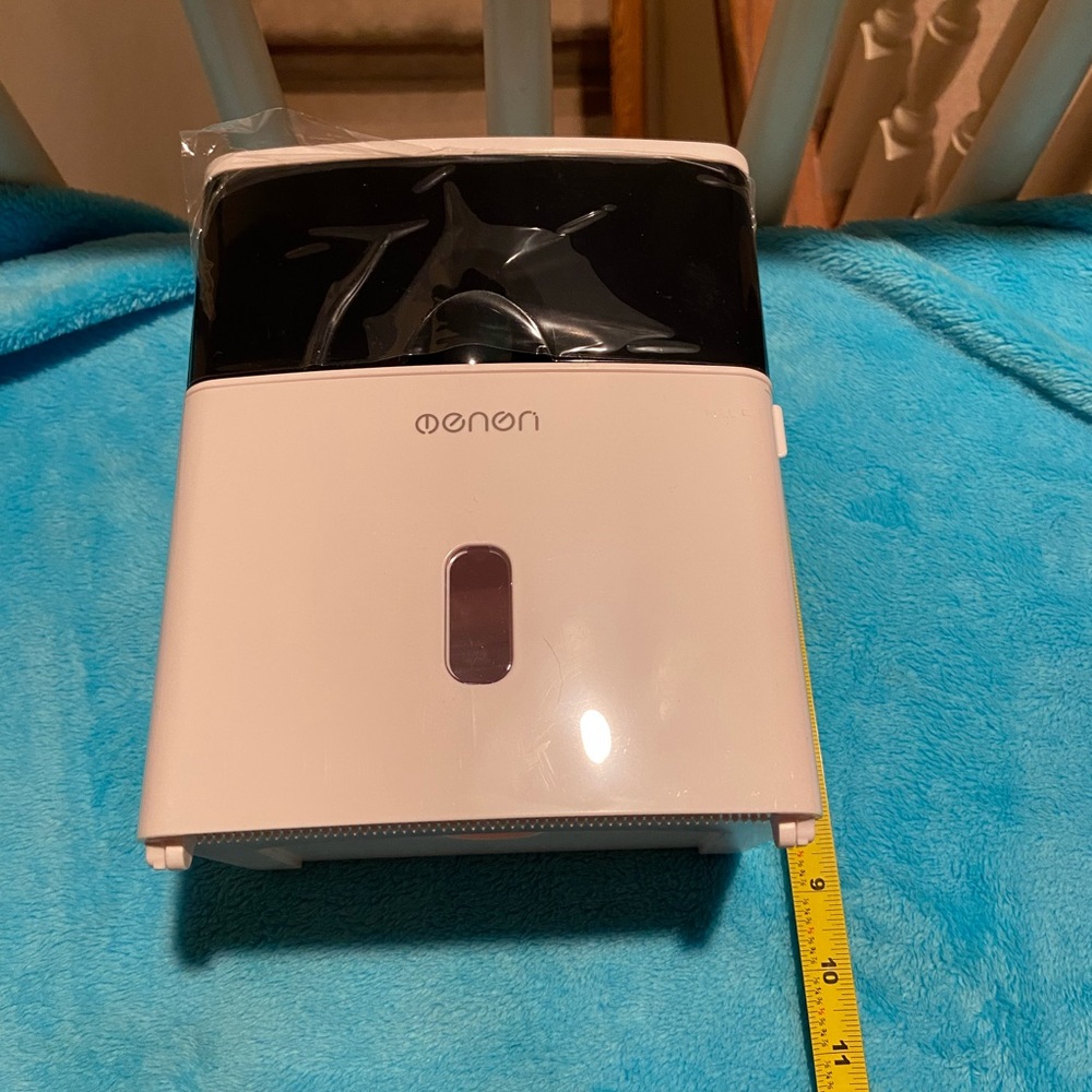 Toilet paper holder with drawer and shelf for phone.